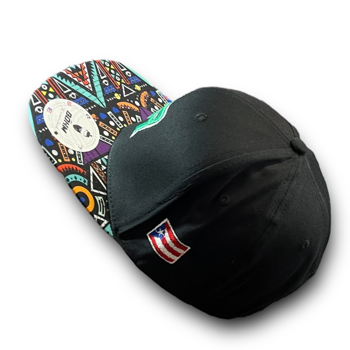 Green Crispy PR Logo on Black Cap with Colorful Geometric Pattern Visor, and Puerto Rico Flag