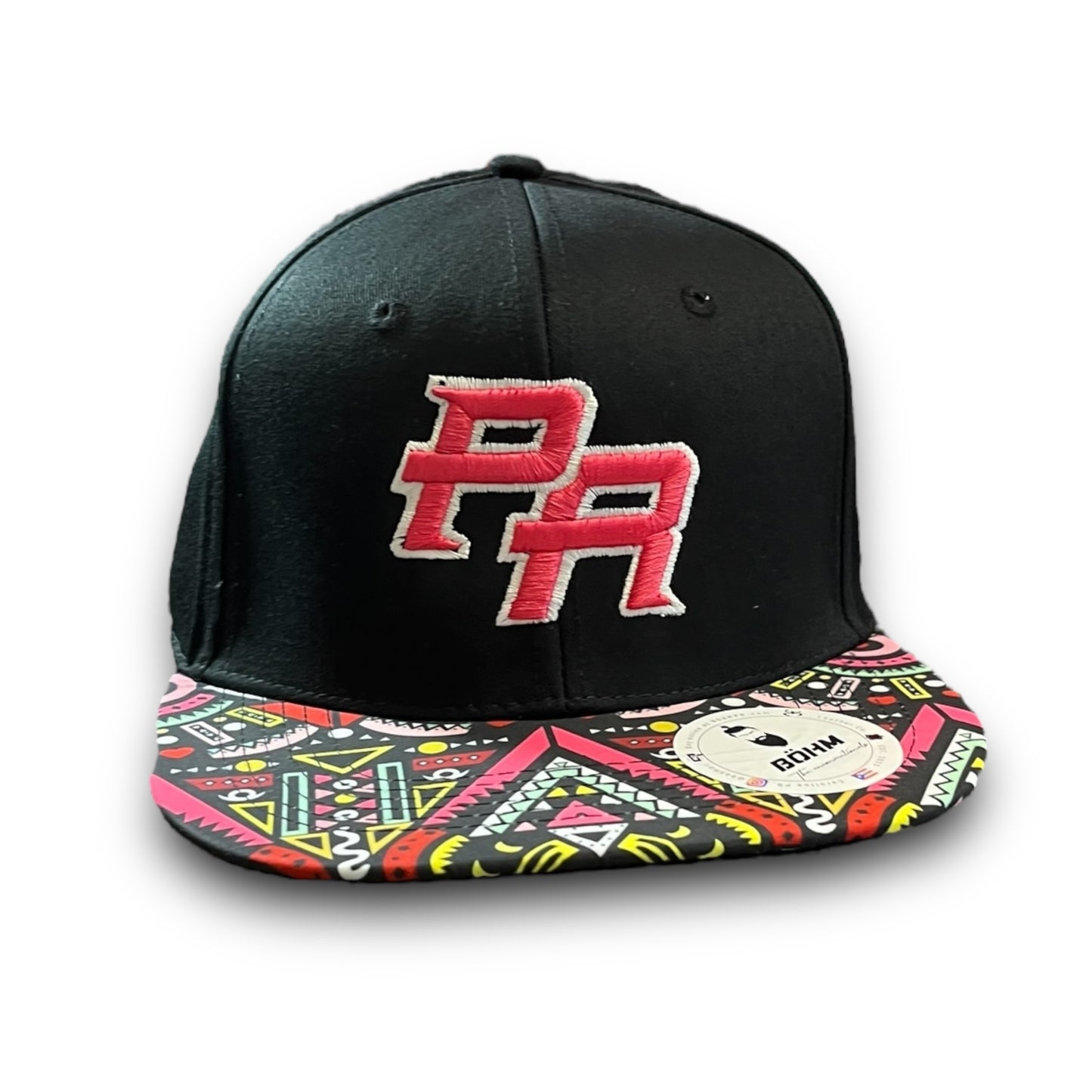 Pink Crispy PR Logo on Black Cap with Colorful Geometric Pattern Visor, and Puerto Rican Flag