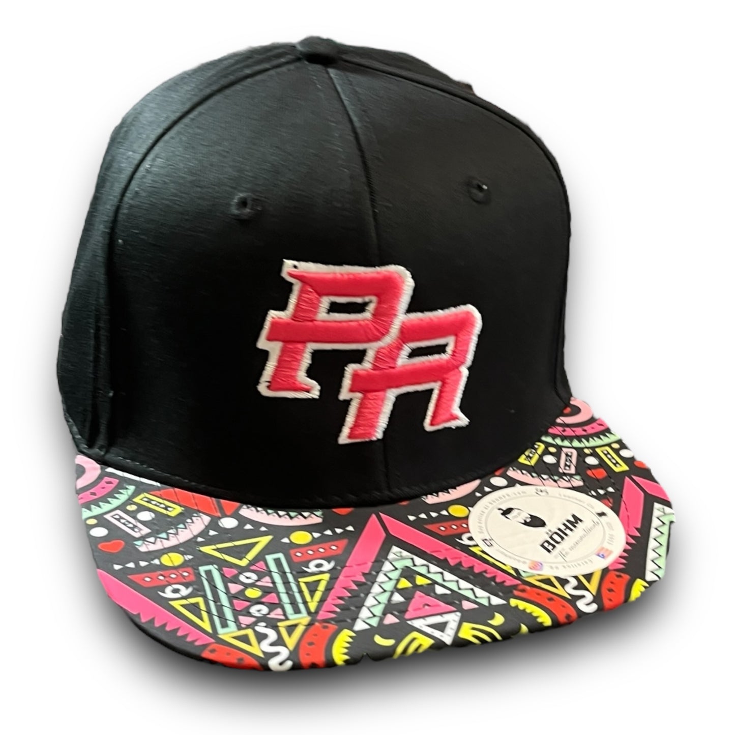 Pink Crispy PR Logo on Black Cap with Colorful Geometric Pattern Visor, and Puerto Rican Flag