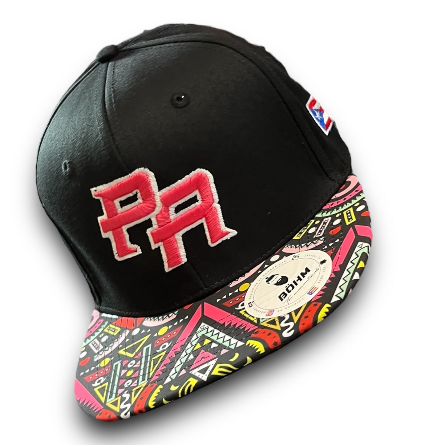 Pink Crispy PR Logo on Black Cap with Colorful Geometric Pattern Visor, and Puerto Rican Flag