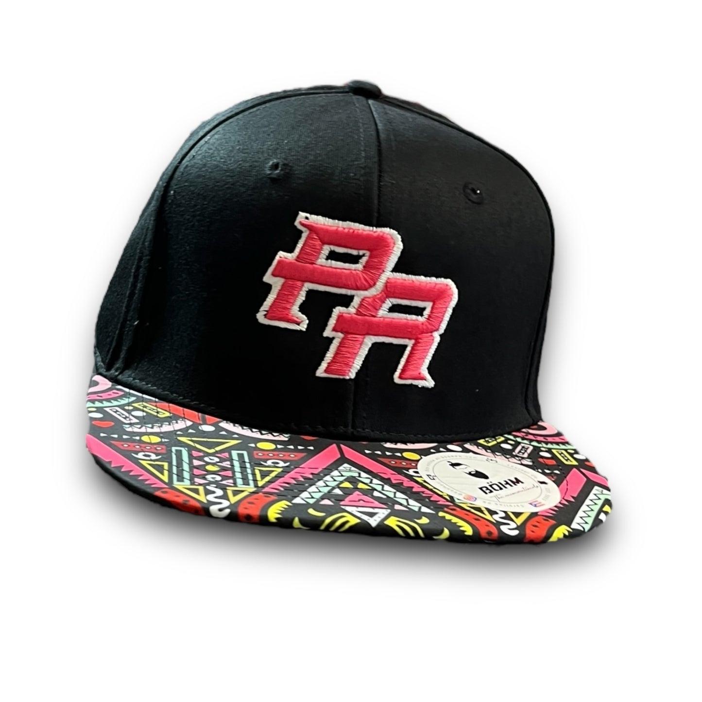 Pink Crispy PR Logo on Black Cap with Colorful Geometric Pattern Visor, and Puerto Rican Flag